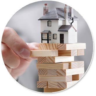 Jenga with a small house sitting on top