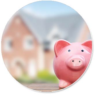 Piggy bank in front of a blurred out house